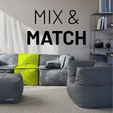 LUMALAND Sitzsack-Sofa Ecke Apfelgrün kombiniert mit modularen grauen Elementen für flexible Wohnzimmergestaltung.